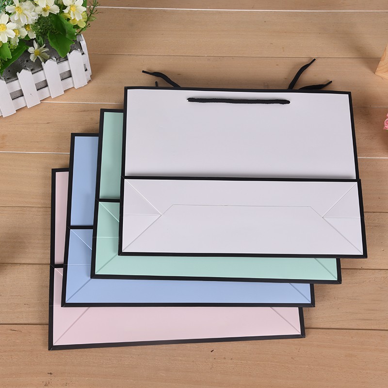 Zhejiang Xinya + printing packaging, customized high-end clothing bags clothes shopping gift packaging handbag